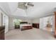 Spacious main bedroom with tray ceilings and ensuite bathroom at 3330 Arborwoods Dr, Alpharetta, GA 30022