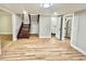 Finished basement area with wood flooring, stairway, bathroom, and neutral paint at 3820 Fox Creek Ct, Marietta, GA 30062
