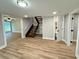 Spacious finished basement with wood-look flooring, stairs, and bathroom at 3820 Fox Creek Ct, Marietta, GA 30062