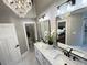 This bright bathroom includes a double vanity, a separate toilet room and glass enclosed shower at 3820 Fox Creek Ct, Marietta, GA 30062