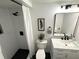 Updated bathroom with white subway tile in the shower, black fixtures, and marble vanity at 3820 Fox Creek Ct, Marietta, GA 30062