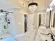This bathroom features double vanities, a walk-in shower, and sleek black hardware at 3820 Fox Creek Ct, Marietta, GA 30062