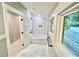 Bathroom featuring a soaking tub, subway tile, and a bright window with natural light at 3820 Fox Creek Ct, Marietta, GA 30062