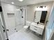Modern bathroom featuring sleek tiling, a glass shower, and updated sink and vanity at 3820 Fox Creek Ct, Marietta, GA 30062