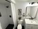 Modern bathroom featuring black hardware, white subway tile shower and marble countertop at 3820 Fox Creek Ct, Marietta, GA 30062