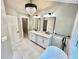 Bathroom boasting a freestanding tub, double vanity with marble countertop and modern lighting at 3820 Fox Creek Ct, Marietta, GA 30062