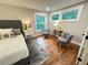 Cozy bedroom with a comfortable bed, hardwood floors, and views of the surrounding nature at 3820 Fox Creek Ct, Marietta, GA 30062
