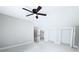 Spacious bedroom features neutral tones, a ceiling fan, and ample closet space at 3820 Fox Creek Ct, Marietta, GA 30062