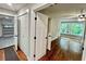 Bedroom with hardwood floors, ceiling fan, and a view of a garage and yard at 3820 Fox Creek Ct, Marietta, GA 30062