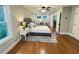 Well-lit bedroom with hardwood floors, neutral decor, and a comfortable, inviting atmosphere at 3820 Fox Creek Ct, Marietta, GA 30062