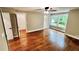 Bedroom with hardwood floors, closet, and natural light from windows overlooking the backyard at 3820 Fox Creek Ct, Marietta, GA 30062