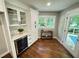 Charming butler pantry featuring a wine cooler, hardwood floors, and access to the deck at 3820 Fox Creek Ct, Marietta, GA 30062