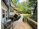 Cozy wooden deck with outdoor seating, surrounded by well-maintained landscaping at 3820 Fox Creek Ct, Marietta, GA 30062
