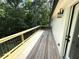 Wooden deck with metal railing overlooking backyard trees at 3820 Fox Creek Ct, Marietta, GA 30062