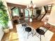 Well-lit dining room features a modern chandelier, wood table and views to the living room at 3820 Fox Creek Ct, Marietta, GA 30062