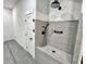 Convenient dog shower with gray subway tile and black hardware in the garage at 3820 Fox Creek Ct, Marietta, GA 30062