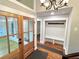 Charming entryway with wooden front doors, coat rack, and hardwood floors at 3820 Fox Creek Ct, Marietta, GA 30062