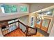 Open staircase to living room and entryway featuring wood railing and chandelier at 3820 Fox Creek Ct, Marietta, GA 30062