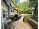 Wooden deck with railing, landscaped pathway, and outdoor seating area at 3820 Fox Creek Ct, Marietta, GA 30062