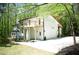 Rear exterior elevation showcasing a two-story home with a wood deck and garage at 3820 Fox Creek Ct, Marietta, GA 30062