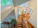 Foyer features wooden stairs with railing and a chandelier hanging over the front door at 3820 Fox Creek Ct, Marietta, GA 30062