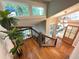 Staircase with wooden steps and a wrought iron railing leading to a bright and open foyer at 3820 Fox Creek Ct, Marietta, GA 30062