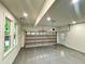 Spacious, clean two-car garage featuring epoxy flooring and an automatic door with side entry door at 3820 Fox Creek Ct, Marietta, GA 30062