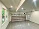 Spacious garage with epoxy floor, recessed lighting, and insulated garage door at 3820 Fox Creek Ct, Marietta, GA 30062