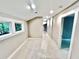 A brightly lit hallway with carpeted floors and access to multiple rooms at 3820 Fox Creek Ct, Marietta, GA 30062