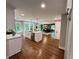 Spacious kitchen with hardwood floors, white cabinets, and a stainless steel dishwasher at 3820 Fox Creek Ct, Marietta, GA 30062