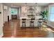 Modern kitchen with a large island, stainless steel appliances, and hardwood floors at 3820 Fox Creek Ct, Marietta, GA 30062