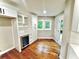 Butler's pantry with built-in wine cooler, storage cabinets, and hardwood floors at 3820 Fox Creek Ct, Marietta, GA 30062