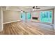 Spacious living room with many windows, hardwood floors, and a modern fireplace at 3820 Fox Creek Ct, Marietta, GA 30062