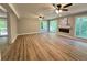 Spacious living room with wood floors, a fireplace, and bright windows at 3820 Fox Creek Ct, Marietta, GA 30062
