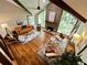 Bright and airy living room with vaulted ceilings, wood beams, and a stone fireplace at 3820 Fox Creek Ct, Marietta, GA 30062