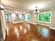 Bright living room with hardwood floors, large windows, and modern lighting fixtures at 3820 Fox Creek Ct, Marietta, GA 30062