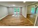 Open-concept living space with wood floors and access to outdoor deck space at 3820 Fox Creek Ct, Marietta, GA 30062