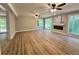 View of the living room with hardwood floors, recessed lights, and a fireplace at 3820 Fox Creek Ct, Marietta, GA 30062