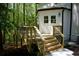 Lovely rear deck overlooking a green yard and surrounded by mature trees at 3820 Fox Creek Ct, Marietta, GA 30062