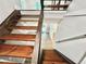 Rustic wood staircase with white risers and trim leading to a lower level at 3820 Fox Creek Ct, Marietta, GA 30062