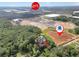 Overhead shot of home close to a data center and the Coca-Cola factory, enveloped by lush greenery at 4682 Stonewall Tell Rd, College Park, GA 30349