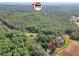 Beautiful aerial view of an Atlanta home surrounded by lush greenery, with a close-up showing a home's exterior at 4682 Stonewall Tell Rd, College Park, GA 30349