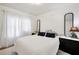 Cozy bedroom featuring a comfortable bed, soft lighting, and stylish bedside decor at 4682 Stonewall Tell Rd, College Park, GA 30349