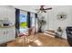 Charming dining area featuring a glass table, stylish chairs, and scenic outdoor views at 4682 Stonewall Tell Rd, College Park, GA 30349