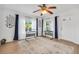 Bright living room with large windows, stylish workstations, and an attractive decorative rug at 4682 Stonewall Tell Rd, College Park, GA 30349