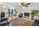 Spacious living area combining kitchen and dining, with modern decor and ample seating at 4682 Stonewall Tell Rd, College Park, GA 30349