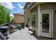 Well-equipped back deck with comfortable seating, a grill, and an access door to the home at 5655 Hedge Brook Dr, Cumming, GA 30028