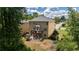 Exterior view of the home with a spacious backyard, a deck, and mature trees at 5655 Hedge Brook Dr, Cumming, GA 30028