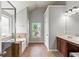 Open bathroom layout with a soaking tub, shower, and natural light at 5655 Hedge Brook Dr, Cumming, GA 30028