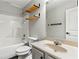 Functional bathroom featuring a tub-shower combination, floating shelves, and neutral wall paint at 5655 Hedge Brook Dr, Cumming, GA 30028
